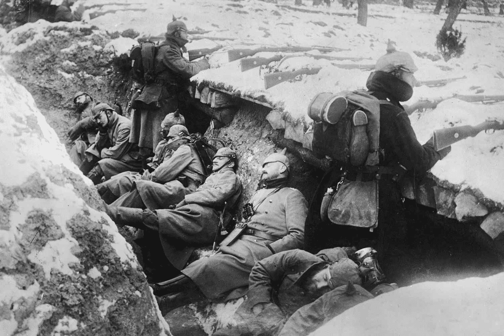 German soldiers sleeping in snow covered trench. 