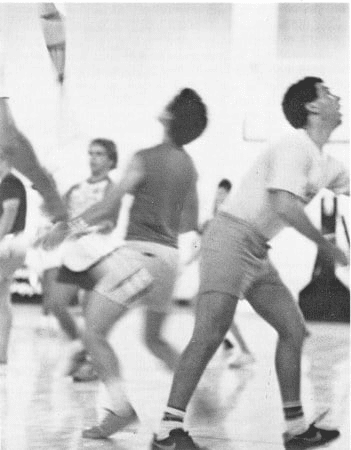 Multiple jugglers in the gym competing in Combat Juggling. 